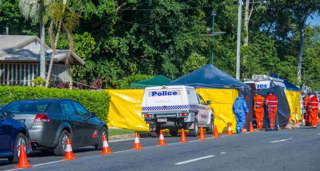 Police work at the scene of a stabbing attack at a home in Cairns