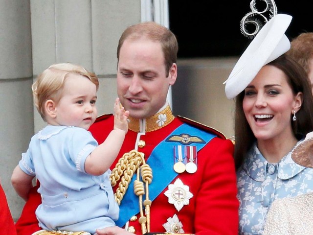 Britain's Prince Willian holds Prince George as he waves with Catherine, the Duchess of Cambridge on the balcony at Buckingham Palace after attending the Trooping the Colour ceremony at Horse Guards Parade in central London