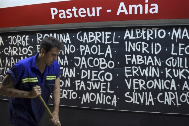 Argentine writer Enrique "Kike" Ferrari mops the floor of a subway station in Buenos Aires, Argentina, on March 14, 2016. Ferrari is an award-winning writer who makes his living cleaning a metro station in Argentina. His noir novels were translated into four languages in six countries, and received awards in Spain and Cuba. AFP PHOTO/EITAN ABRAMOVICH / AFP / EITAN ABRAMOVICH