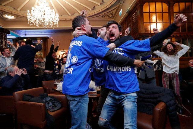 Britain Football Soccer - Leicester City fans watch the Chelsea v Tottenham Hotspur game in pub in Leicester - 2/5/16 Leicester City fans celebrate Chelsea's second goal Reuters / Eddie Keogh Livepic