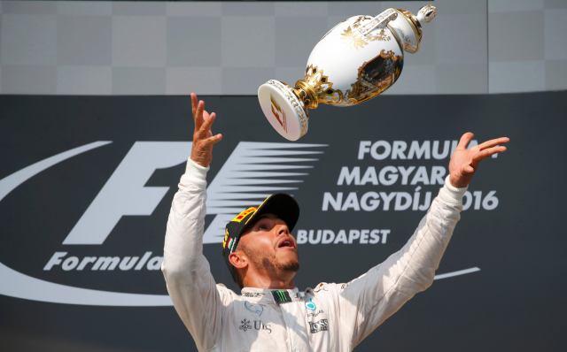 Hungary Formula One - F1 - Hungarian Grand Prix 2016 - Hungaroring, Hungary - 24/7/16 Mercedes' Lewis Hamilton celebrates after winning the race REUTERS/Laszlo Balogh TPX IMAGES OF THE DAY