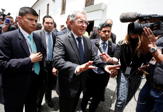 Colombian former President and Senator Uribe arrives before a meeting with Colombia's President Santos at Narino Palace in Bogota, Colombia