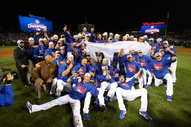 Oct 22, 2016; Chicago, IL, USA; The Chicago Cubs celebrate defeating the Los Angeles Dodgers in game six of the 2016 NLCS playoff baseball series at Wrigley Field. Cubs win 5-0 to advance to the World Series. Mandatory Credit: Jerry Lai-USA TODAY Sports