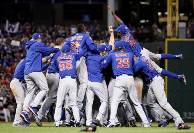 CLEVELAND, OH - NOVEMBER 02: The Chicago Cubs celebrate after winning 8-7 against the Cleveland Indians in Game Seven of the 2016 World Series at Progressive Field on November 2, 2016 in Cleveland, Ohio. The Cubs win their first World Series in 108 years.   Ezra Shaw/Getty Images/AFP