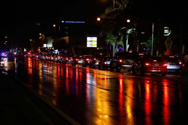 Cars line the street as Cuban Americans celebrate upon hearing about the death of longtime Cuban leader Fidel Castro in the Little Havana neighborhood of Miami, Florida on November 26, 2016. Cuba's socialist icon and father of his country's revolution Fidel Castro died on November 25 aged 90, after defying the US during a half-century of ironclad rule and surviving the eclipse of global communism. / AFP PHOTO / RHONA WISE