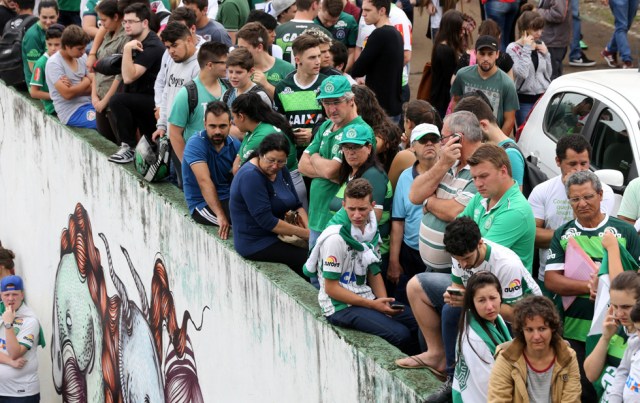 Fans of Chapecoense soccer team are pictured in front of the Arena Conda stadium in Chapeco, Brazil, November 29, 2016. REUTERS/Paulo Whitaker