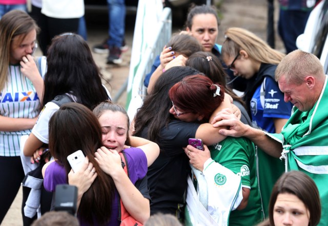 Fans of Chapecoense soccer team react in front of the Arena Conda stadium in Chapeco, Brazil, November 29, 2016. REUTERS/Paulo Whitaker