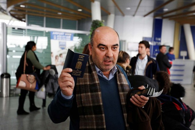 Fuad Sharef Suleman shows his passport to the media after U.S. President Donald Trump's decision to temporarily bar travellers from seven countries, including Iraq, at Erbil International Airport, Iraq, January 29, 2017. REUTERS/Ahmed Saad