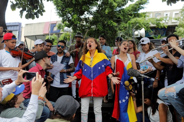 Young musicians sing and play music during a gathering against Venezuela's President Nicolas Maduro's government in Caracas, Venezuela June 4, 2017. REUTERS/Marco Bello