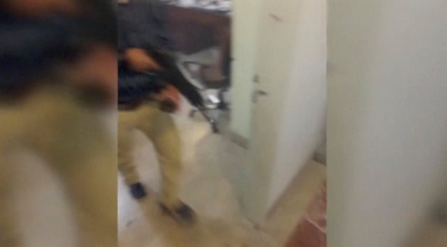 A still image taken from a video released on the internet by Islamic State-affiliated Amaq News Agency, on June 7, 2017, purports to show a man with a gun walking in office said to be inside Iranian parliament in Tehran, Iran. Social Media Website via Reuters TV ATTENTION EDITORS - THIS IMAGE HAS BEEN SUPPLIED BY A THIRD PARTY. IT IS DISTRIBUTED, EXACTLY AS RECEIVED BY REUTERS, AS A SERVICE TO CLIENTS. REUTERS IS UNABLE TO INDEPENDENTLY VERIFY THE CONTENT OF THIS VIDEO, WHICH HAS BEEN OBTAINED FROM A SOCIAL MEDIA WEBSITE. EDITORIAL USE ONLY. NO RESALES. NO ARCHIVE