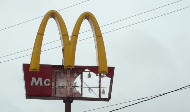 A McDonald's sign damaged by Hurricane Harvey is seen in Port Lavaca, Texas August 26, 2017. REUTERS/Rick Wilking