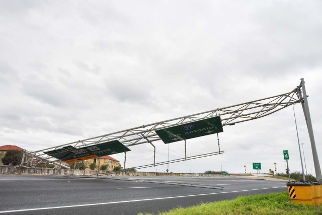 A collapsed overhead gantry lies across Interstate 37, blocking the highway due to damage caused by Hurricane Harvey in Corpus Christie, Texas, U.S., August 26, 2017.   REUTERS/Mohammad Khursheed?