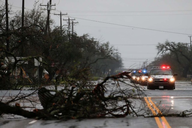A fallen tree lies along a road as an emergency response team arrives to assess damage from Hurricane Harvey in Rockport, Texas, U.S. August 26, 2017. REUTERS/Adrees Latif