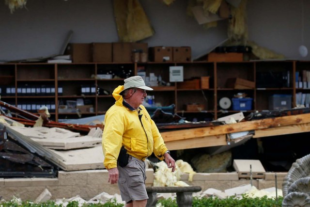A man assesses damage to the First Baptist Church after it was hit by Hurricane Harvey in Rockport, Texas, U.S. August 26, 2017. REUTERS/Adrees Latif