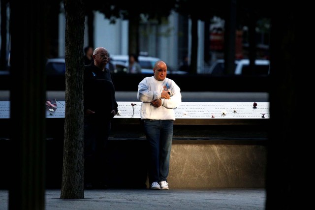 A man pauses at the edge of the south reflecting pool at the National September 11 Memorial and Museum during ceremonies marking the 16th anniversary of the September 11, 2001 attacks in New York, U.S, September 11, 2017. REUTERS/Brendan McDermid