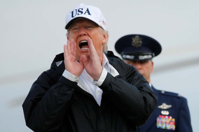 U.S. President Donald Trump answers a reporter's question as he boards Air Force One for travel to view Hurricane Irma response efforts in Florida, from Joint Base Andrews, Maryland, U.S., September 14, 2017. REUTERS/Jonathan Ernst