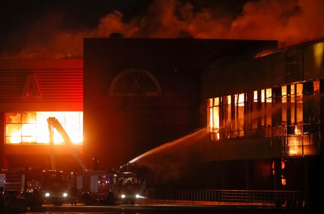 Firefighters work to extinguish fire at a construction goods market on the northwestern edge of Moscow, Russia October 8, 2017. REUTERS/Maxim Shemetov