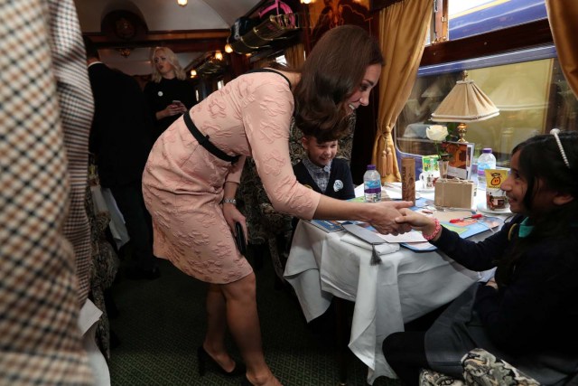 Britain's Catherine, The Duchess of Cambridge speaks to children onboard the Belmond British Pullman train at Paddington Station as she attends the Charities Forum in London, October 16, 2017. REUTERS/Jonathan Brady/Pool