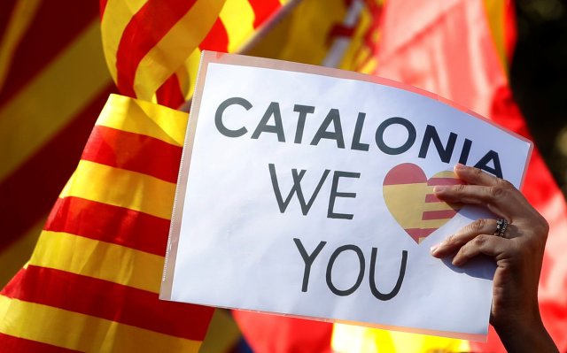 A pro-unity supporter takes part in a demonstration in central Barcelona, Spain, October 29, 2017. REUTERS/Yves Herman