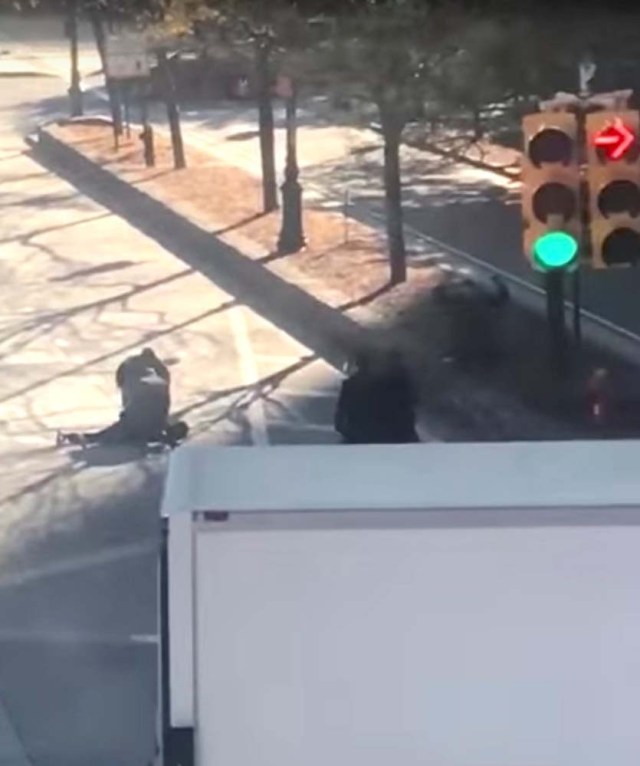 Police officers are seen surrounding someone on the ground in the middle of a road after a pickup truck mowed down pedestrians and cyclists on a bike path alongside the Hudson River, in New York City, NY, U.S., in this still image from a video obtained from social media October 31, 2017. TAWHID KABIR XISAN via REUTERS THIS IMAGE HAS BEEN SUPPLIED BY A THIRD PARTY. MANDATORY CREDIT. NO RESALES. NO ARCHIVES. MUST ON SCREEN COURTESY TAWHID KABIR XISAN