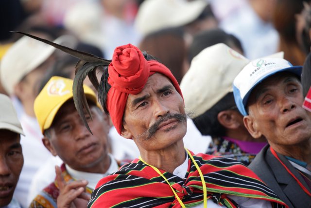 A Catholic faithful attends a mass led by Pope Francis at Kyite Ka San Football Stadium in Yangon, Myanmar November 29, 2017. REUTERS/Max Rossi