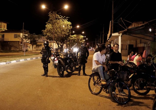 Police officers patrol a street in the working-class neighbourhood of Caimbe on Boa Vista's west side where most Venezuelan immigrants live, Roraima state, Brazil November 18, 2017. REUTERS/Nacho Doce SEARCH "VENEZUELAN MIGRANTS" FOR THIS STORY. SEARCH "WIDER IMAGE" FOR ALL STORIES.