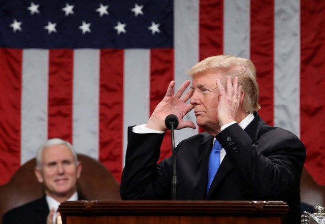 With Vice President Mike Pence looking on, U.S. President Donald Trump delivers his first State of the Union address to a joint session of Congress inside the House Chamber on Capitol Hill in Washington, U.S., January 30, 2018. REUTERS/Win McNamee/Pool