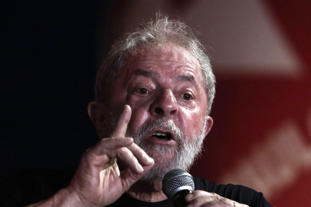 (FILES) This file photo taken on January 24, 2018 shows former Brazilian president Luiz Inacio Lula da Silva speaking during a rally in his support by trade unionists and members of social movements in Sao Paulo, Brazil. Brazilian President Michele Temer said on January 29, 2018 on a radio program that charismatic Lula is not dead politically despite his graft conviction was upheld by justice and his presidential candidacy is on stake.  / AFP PHOTO / Miguel SCHINCARIOL