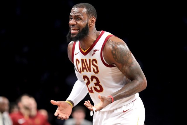 NEW YORK, NY - MARCH 25: LeBron James #23 of the Cleveland Cavaliers reacts to a call in the first quarter against the Brooklyn Nets during their game at Barclays Center on March 25, 2018 in the Brooklyn borough of New York City. NOTE TO USER: User expressly acknowledges and agrees that, by downloading and or using this photograph, User is consenting to the terms and conditions of the Getty Images License Agreement.   Abbie Parr/Getty Images/AFP