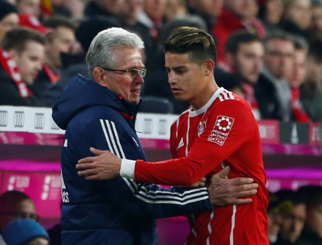 Soccer Football - Bundesliga - Bayern Munich vs Borussia Dortmund - Allianz Arena, Munich, Germany - March 31, 2018   Bayern Munich's James Rodriguez with coach Jupp Heynckes after being substituted   REUTERS/Michaela Rehle    DFL RULES TO LIMIT THE ONLINE USAGE DURING MATCH TIME TO 15 PICTURES PER GAME. IMAGE SEQUENCES TO SIMULATE VIDEO IS NOT ALLOWED AT ANY TIME. FOR FURTHER QUERIES PLEASE CONTACT DFL DIRECTLY AT + 49 69 650050