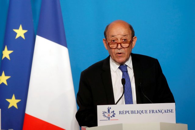 French Minister for Foreign Affairs Jean-Yves Le Drian makes an official statement with French Minister of the Armed Forces Florence Parly (not pictured) in the press room at the Elysee Palace, in Paris, France, April 14, 2018. The French military on Saturday targeted Syria's main chemicals research centre as well as two other facilities, hours after President Emmanuel Macron ordered a military intervention in Syria alongside the United States and Britain in an attack on the chemical weapons arsenal.  Michel Euler/Pool via Reuters