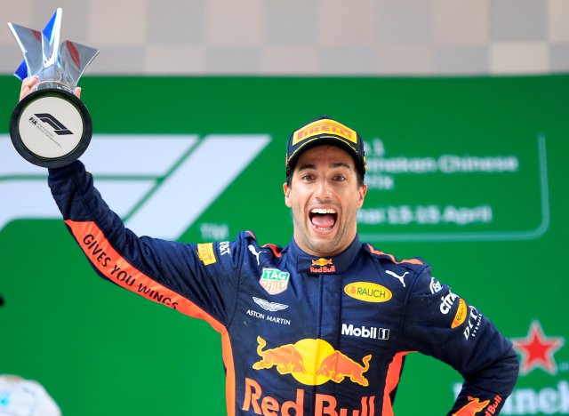 Formula One F1 - Chinese Grand Prix - Shanghai International Circuit, Shanghai, China - April 15, 2018 Red Bull's Daniel Ricciardo celebrates with a trophy on the podium after winning the race REUTERS/Aly Song