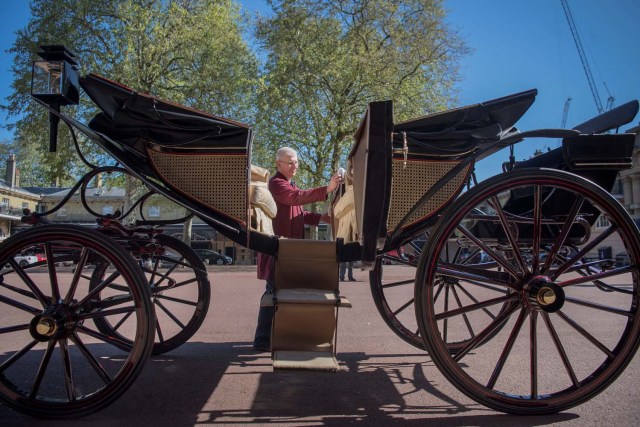 Martin Oates, Senior Carriage Restorer, polishes the Ascot Landau, which will be used in the case of dry weather at the wedding of Prince Harry and Meghan Markle, at the Royal Mews at Buckingham Palace, London. Picture taken May 1, 2018. REUTERS/Victoria Jones/Pool