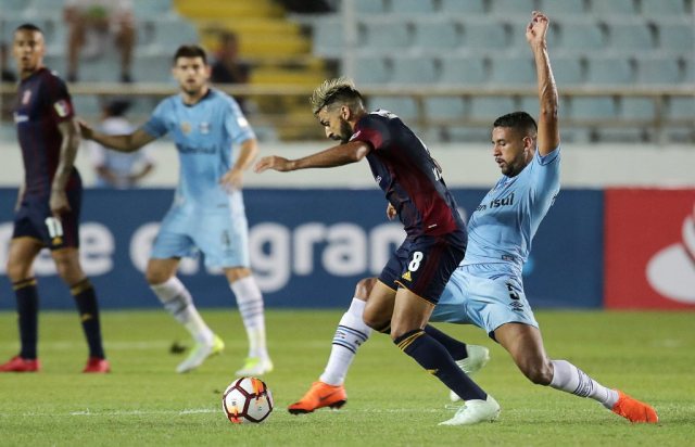 Football Soccer - Monagas SC v Gremio - Copa Libertadores - Monumental Stadium, Maturin, Venezuela - May 15, 2018. Javier Garcia (8) of Monagas SC and Michel of Gremio in action. REUTERS/William Urdaneta