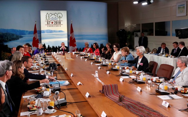 Canada's Prime Minister Justin Trudeau delivers opening remarks as U.S. President Donald Trump's seat sits unfilled during the start of the Gender Equality Advisory Council breakfast before President Trump showed up late during the G-7 summit in the Charlevoix city of La Malbaie, Quebec, Canada, June 9, 2018. REUTERS/Leah Millis